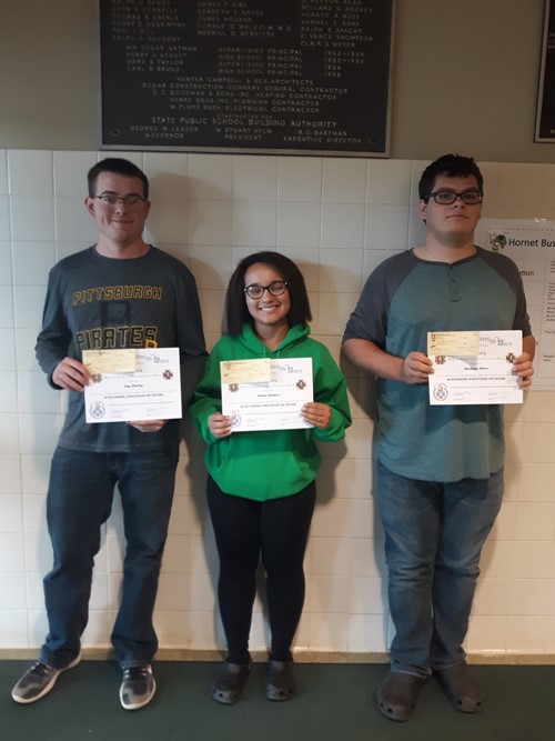 Photo of students holding reward certificates